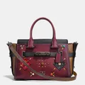 Coach Swagger 27 With Colorblock Patchwork Prairie Rivets
WINE/BLACK COPPER