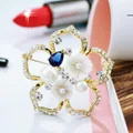 Flower shell pearl brooch