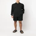 Moschino all-over logo print shorts - Black