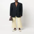 Jil Sander pressed-crease flared cropped trousers - Yellow