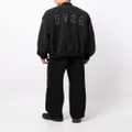 izzue text-embroidered press-stud bomber jacket - Black