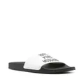Moschino logo-embossed faux-leather slides - White
