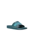 Moschino logo-embossed moulded-footbed slides - Blue