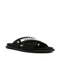 Moschino logo-embossed crossover-strap sandals - Black
