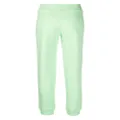 Moschino embossed-logo jersey trousers - Green