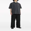 izzue logo-appliqué loose-fit trousers - Black