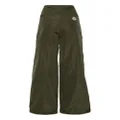 Moncler logo-appliqué flared trousers - Green