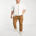 ASOS DESIGN tapered cargo pants in cord in brown