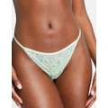 Weekday Debbie lace trim thong in ditsy green floral