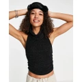 Free People Autumn Angst knitted halterneck backless top in black
