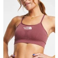 The North Face Training seamless performance sports bra in pink Exclusive at ASOS