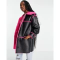 Miss Selfridge contrast faux fur faux leather longline coat in black with pink