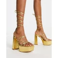 Truffle Collection mega platform strappy sandals in gold metallic