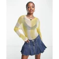 Weekday Tina lightweight knitted sweater in yellow tie dye print