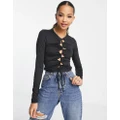 Monki cut-out drawstring long sleeve top in black