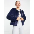Unreal Fur collarless faux fur cropped jacket in navy