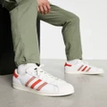 adidas Originals Superstar sneakers in white and multi red
