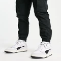 PUMA Slipstream Mid Heritage sneakers in white and black