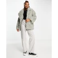 Monki curly faux fur jacket in grey-Neutral