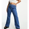 ASOS DESIGN Curve flared jeans in mid blue
