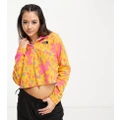 The North Face Glacier 1/4 zip cropped fleece in yellow flower print Exclusive at ASOS