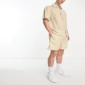 ellesse Capri shirt with lightning bolt print in beige (part of a set)-Brown