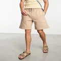 ASOS DESIGN heavyweight oversized jersey shorts in beige-Neutral