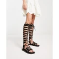 Free People Sun Chaser tall gladiator sandals in black