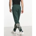 Armani Exchange trackies in green