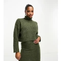 ASOS DESIGN Petite boxy jumper in rib with roll neck in khaki (part of a set)-Green