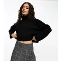 ASOS DESIGN Petite boxy jumper in rib with roll neck in black