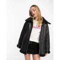 Monki faux leather and shearing aviator jacket in black