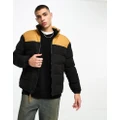 Timberland Welch Mountain puffer jacket in black with wheat yoke detailing