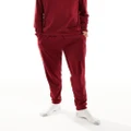 Tommy Hilfiger ribbed logo waistband trackies in burgundy-Red