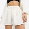 ASOS DESIGN Petite textured beach shorts in white (part of a set)