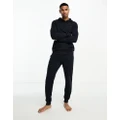Tommy Hilfiger knitted logo trackies in navy