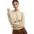 Monki knitted turtleneck sweater in beige-Neutral