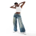 Motel roomy extra wide low rise jeans in extreme blue green