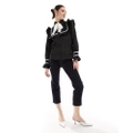 Sister Jane contrast stitch bow shirt in black