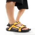 The North Face Explore Camp sandals in black and gold