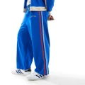Reclaimed Vintage baggy sport track trackies with side stripe in blue (part of a set)