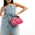 DKNY Arden top handle bag with cross body strap in pink croc