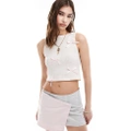 Reclaimed Vintage Revived x Glass Onion cropped tank top with bows-White