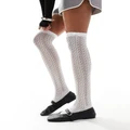 COLLUSION high knee pointelle socks with bow in white