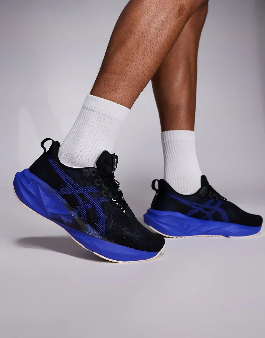 Asics Novablast 5 trainers in black and blue